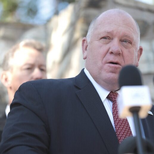 NYC immigrants prep for Trump: Tom Homan middle aged man balding with white hair in dark suit and white shirt stands speaking into microphone