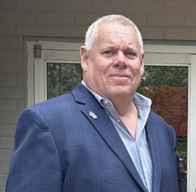 Amite school segregation academies: White middle age man with short silver hair in navy suit with light blue shirt