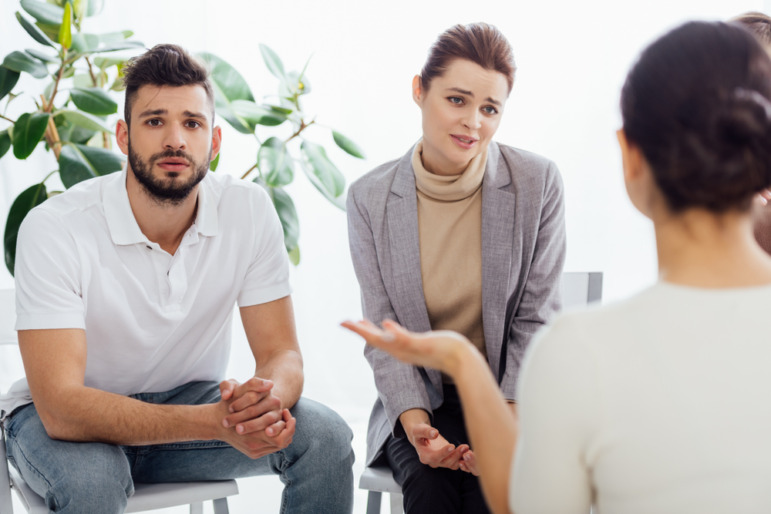 Curriculum fidelity k-12: group of people sitting and having discussion during meeting