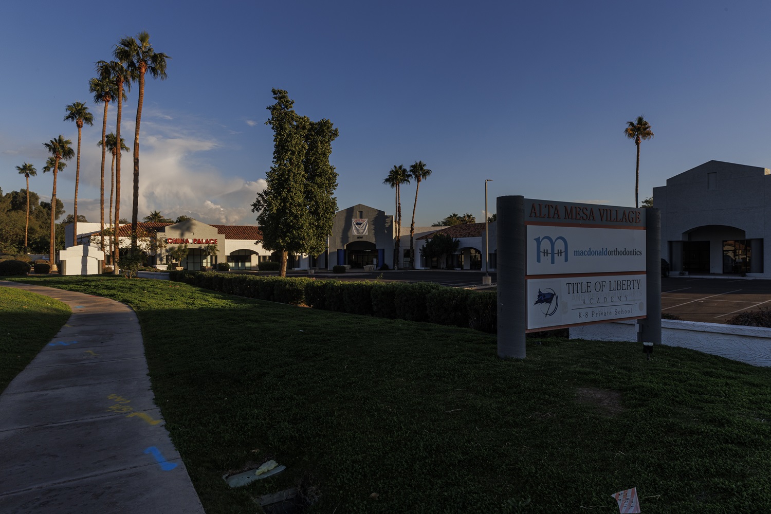 Arizona regulators closed failing charter school_It reopened private religious school funded by taxpayers: a shopping center sign with Title of Liberty academy sign still on it