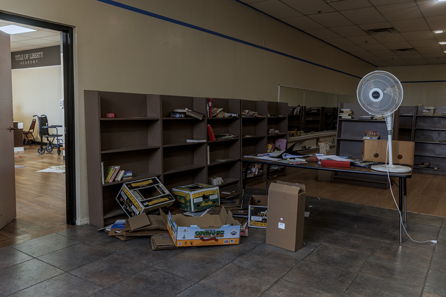 Arizona regulators closed failing charter school_It reopened private religious school funded by taxpayers: abandoned room with fallen boxes and white standing fan on table