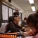 Maryland push to scale up high dosage math tutoring: black female student working at desk in school