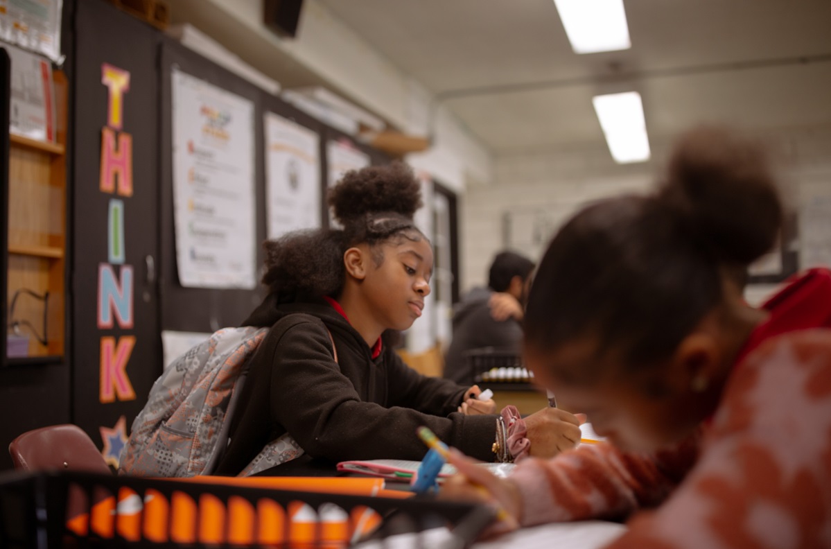 Maryland push to scale up high dosage math tutoring: black female student working at desk in school