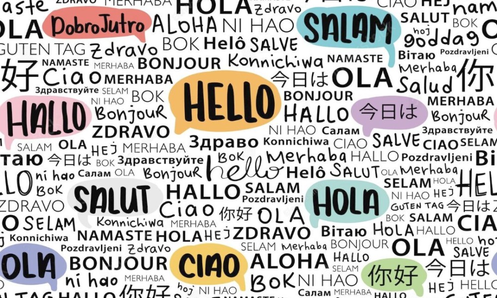 ilingual children: Word cloud of "hello" in multiple languages in handprinted text in black on white with some words in pastel-colored bubbles