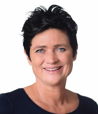 and writing versus keyboard: Headshot woman with short black hair in black top