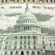 Federal funding pause: Close up of White House image on United States paper currency in green on off-white