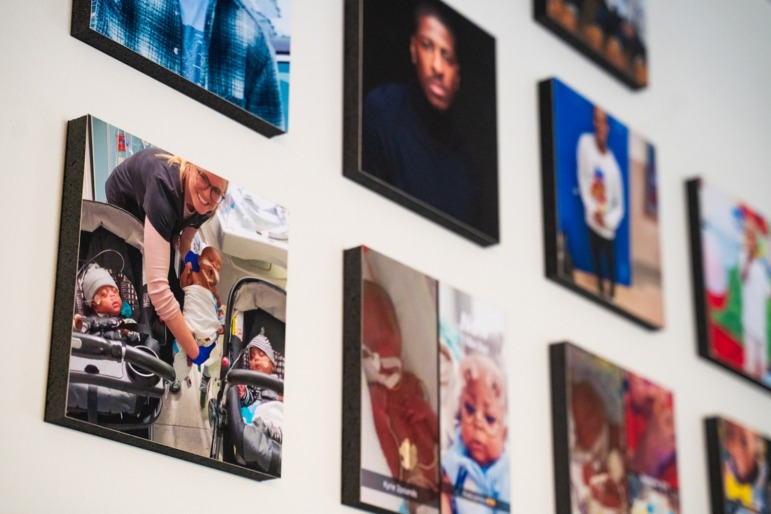 Parents of premature babies struggle to get help their children are entitled to: family photos on a wall