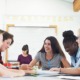 The disengagement gap_Why student engagement isn’t what parents expect: group of students smiling and working at classroom table