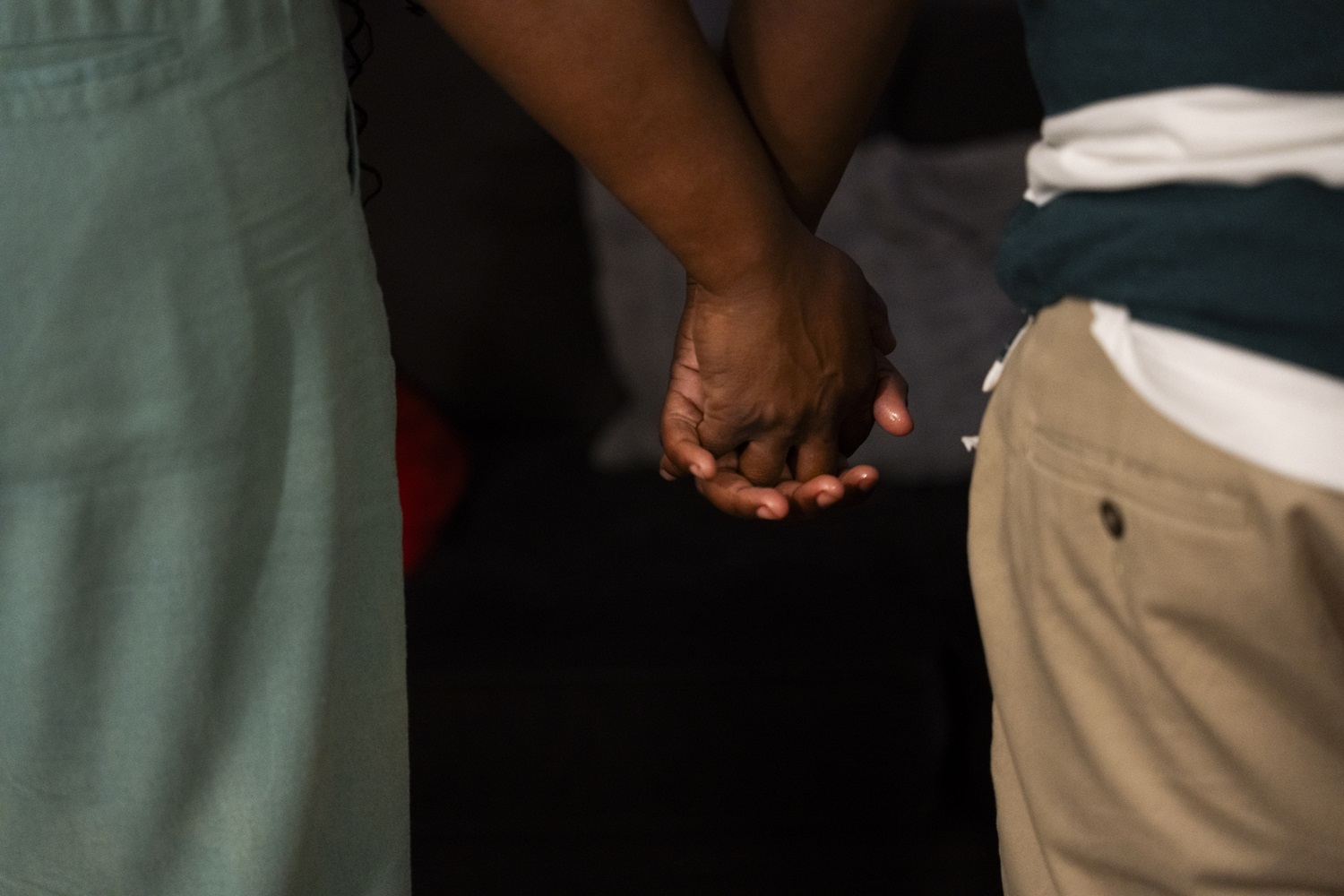 Two families sue after 11-year-old and 13-year-old students were arrested under Tennessee school threat law: view of black mother and child holding hands