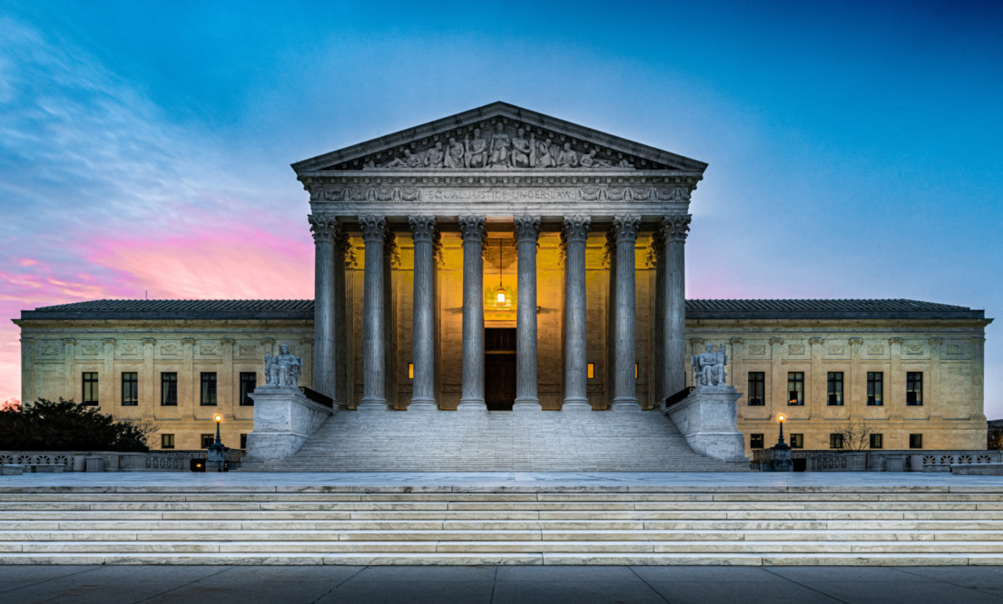 U.S. Supreme Court religious charter schools: US Supreme Court building under sunset evening sky with ominous shadows on front of building pillars