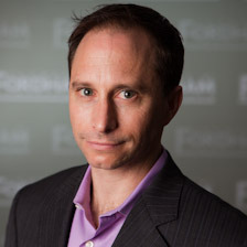 US Supreme Court religious charter school case:: Headshot man with short dark hair in black suit and lavender shirt