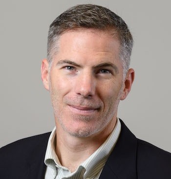 US Supreme Court religious charter school case:: Headshot man with short graying dark hair in black suit and beige