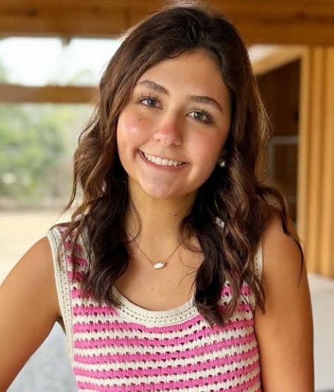 New effort fights distracted driving from the passenger seat_Olivia Coiner headshot: young brunette girl with striped shirt smiling outside