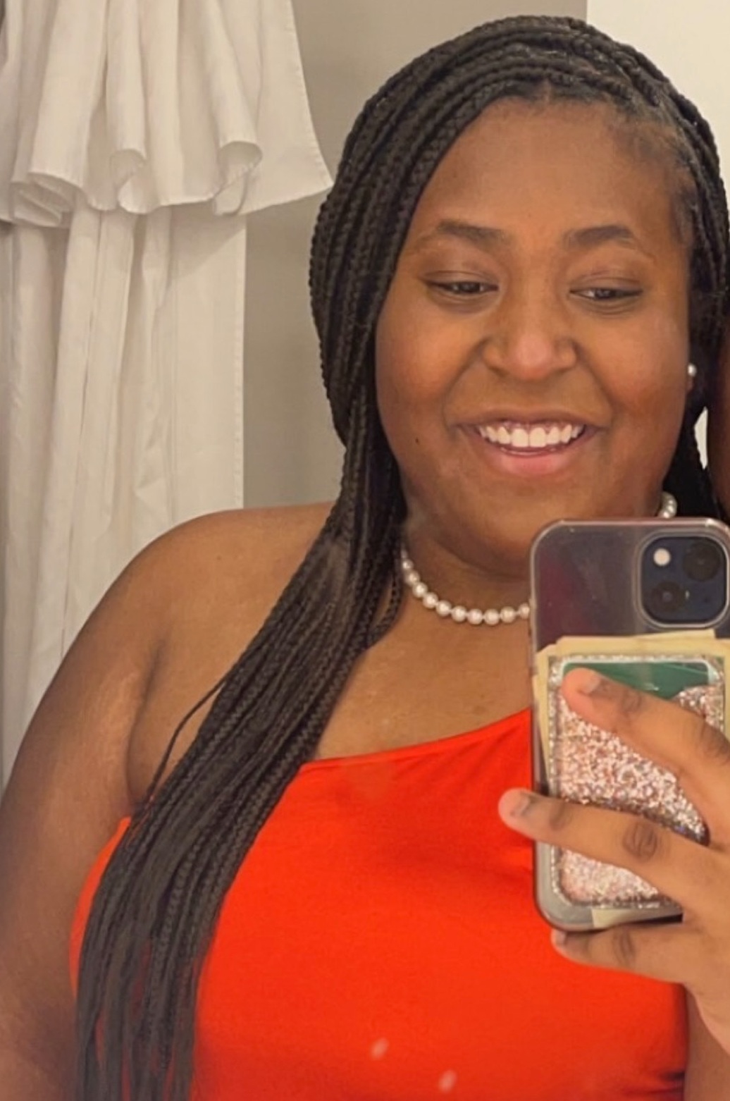 New effort fights distracted driving from the passenger seat_Sydney Montgomery headshot: young black woman with long hair taking a phone selfie wearing red