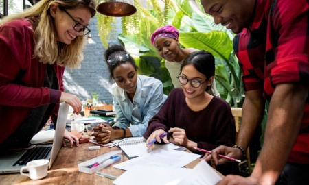 what is the next step_career pathways, postsecondary transition: group of youths being helped at table by woman