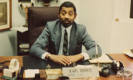 The path blazed by Karl Dennis_Father of Wraparound, wraparound services: old photo of black man in suit sitting at desk