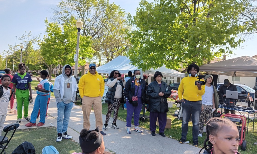 Competitive youth sports culture_opening day feature: group of parents and kids at sports event opening day