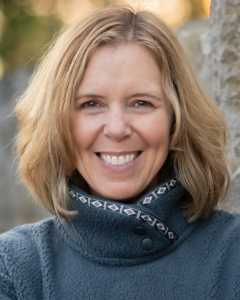 Shifting culture of youth sport by supporting coaches_Dawn Anderson-Butcher headshot: white woman with medium length blonde hair smiling outdoors in turtle neck