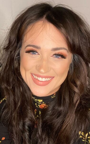 Kathryn Tapp headshot: young white woman with long dark hair smiling