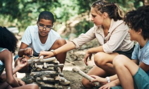youth workforce, credit for prior learning: group of youth at youth camp building wooden structure through teamwork