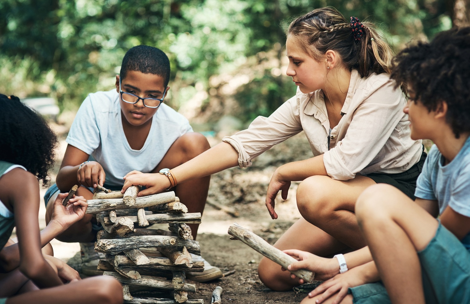 Weissberg and Durlak SAFE model_feature: group of youth at youth camp building wooden structure through teamwork