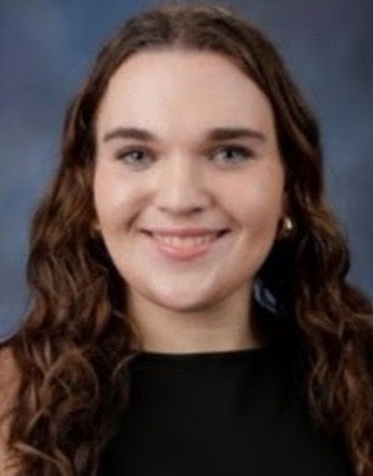 Brooklyn Senneway headshot: young white girl with long dark hair in black shirt