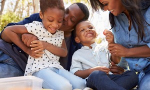 Prevention with protection_Making Family First Prevention Services Act work for every child: happy black family outdoors