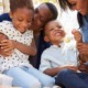Prevention with protection_Making Family First Prevention Services Act work for every child: happy black family outdoors