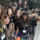 Evolving with teens_Building programs to keep them connected through grief_feature: group of teen girls in matching black shirts smiling
