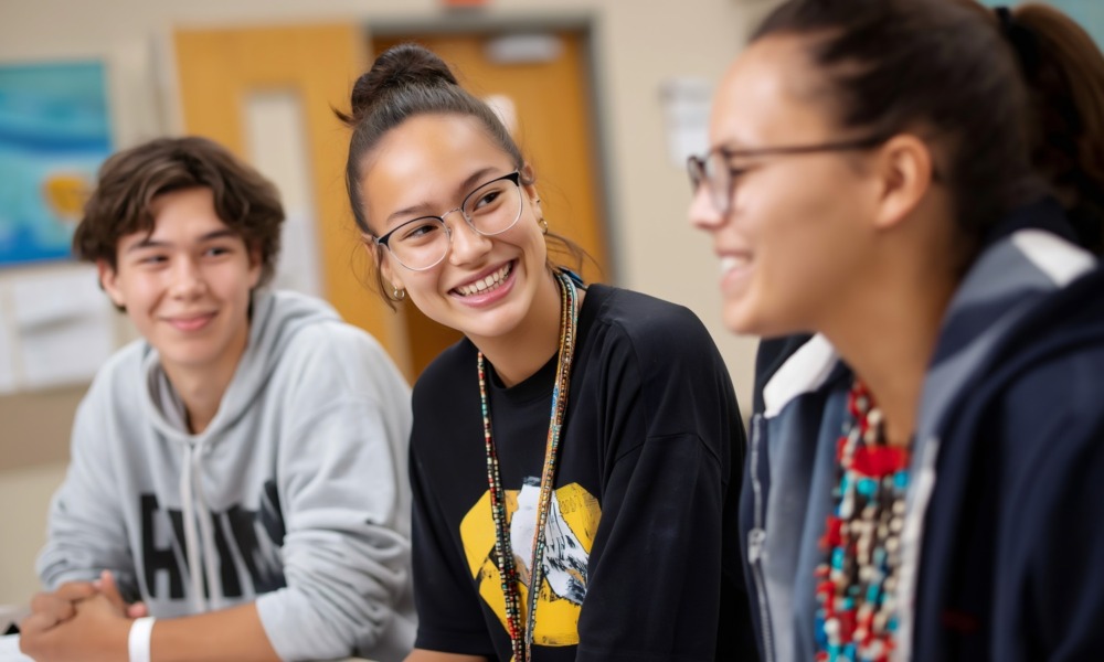 On readiness to change, youth development_feature: three youths at youth organization even happily discussing something