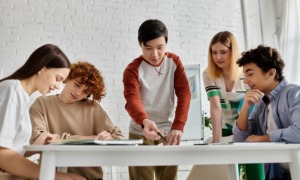 On learning and meaning making _feature: group of youth working at table together