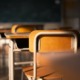 The empty desk_A student's view of the siege in our hallways_feature: shadowy classroom with empty desks
