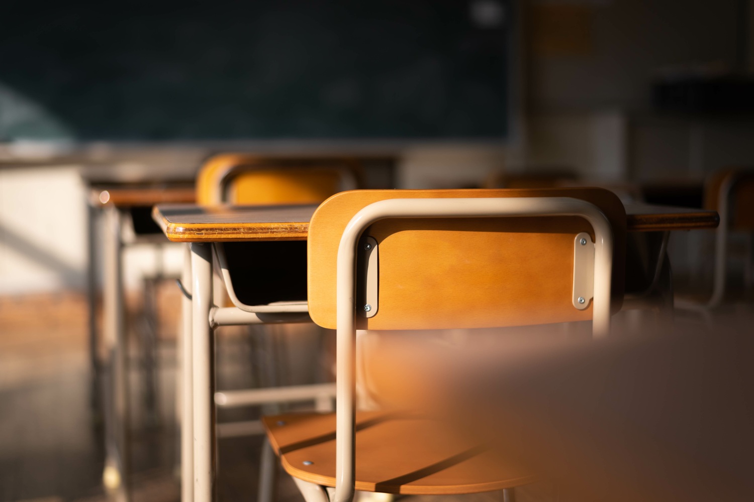 The empty desk_A student's view of the siege in our hallways_feature: shadowy classroom with empty desks