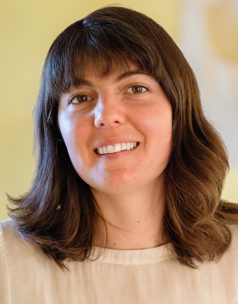 Carly Swanson headshot: white woman with medium-length brown hair smiling