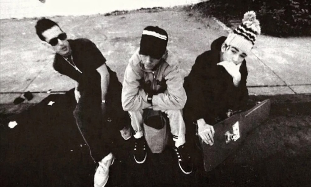 Look inside_What MCA taught us about gratitude, growth and growing up_Pass the Mic 4_feature: black and white image of three youths sitting on curb