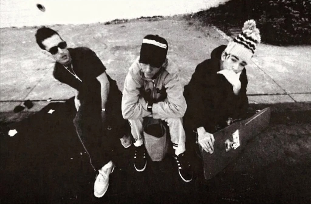 Look inside_What MCA taught us about gratitude, growth and growing up_Pass the Mic 4_feature: black and white image of three youths sitting on curb