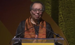 QA_ Karen Pittman _2026 NEA Foundation’s Outstanding Service Public Education Award_older black woman stand at podium with hands clasped in front of her
