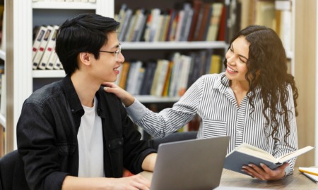 Workforce readiness should start before college_feature: young female mentor helping high school student one-on-one