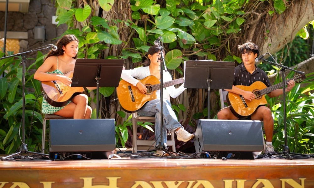 Q&A Maxwell Shei, Open Keys_feature: group of youth play guitars on stage with greenery in background