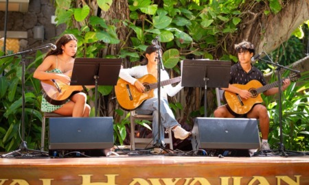 Q&A Maxwell Shei, Open Keys_feature: group of youth play guitars on stage with greenery in background