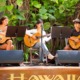 Q&A Maxwell Shei, Open Keys_feature: group of youth play guitars on stage with greenery in background