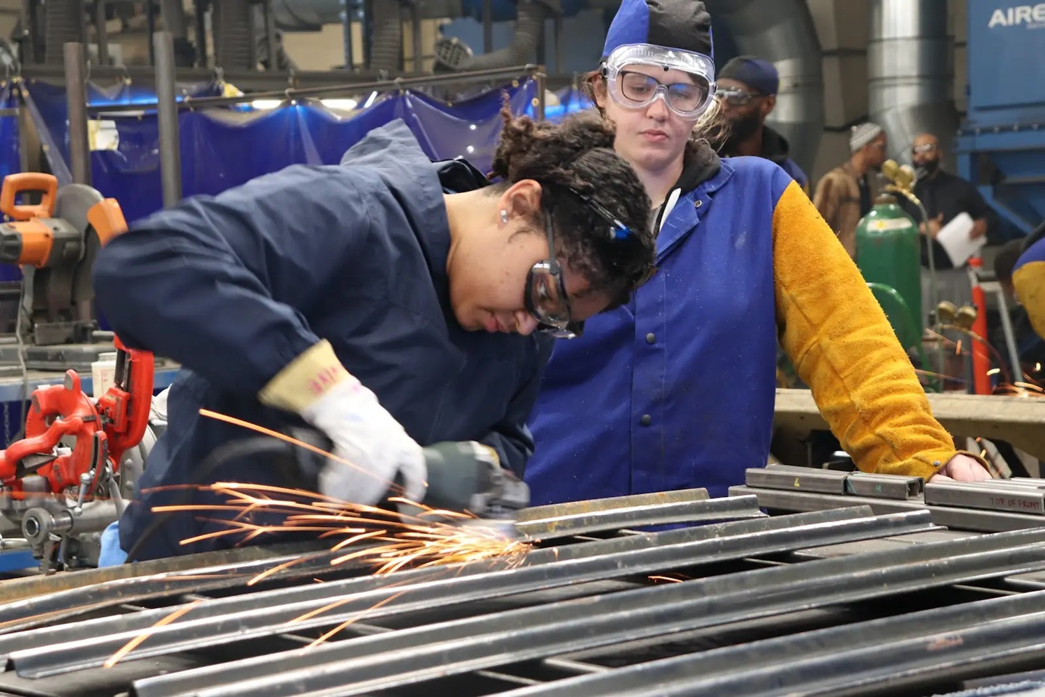 Why America must invest in apprenticeships — now_feature: a young metal working apprentice works in a metal shop
