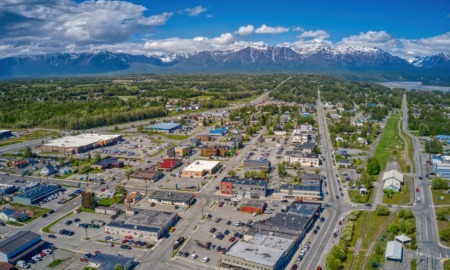 Alaska community grant, arts, culture, social services, educator support scholarship grants_feature: aerial view of Palmer, Alaska with mountains in the distance