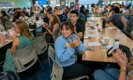 When young people lead, communities change-Meet the new class of Carnegie Young Leaders_feature: large group of youths filling conference room smiling and clapping
