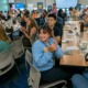 When young people lead, communities change-Meet the new class of Carnegie Young Leaders_feature: large group of youths filling conference room smiling and clapping