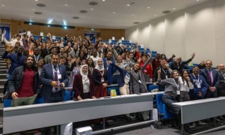 Global sustainability award grants for youth, universities, and organizations_feature: large group of happy people in presentation room