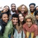 Latino community support grants: group of young multi-ethnic Latino youths smiling for camera