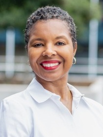 Vanderlyn Sewell headshot: behavioral health, older black woman with short graying hair wearing white collared shirt smiling outdoors