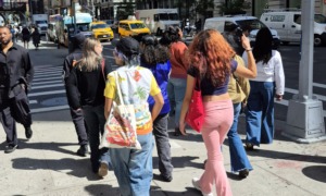 Fashion Forward Kinspire showed me my future was possible_The people and principles behind it_feature: group of young people walk along a New York City street