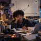 Productive struggle, J Dilla, and knowing when enough is enough_feature: illustrated image of young black boy at desk with lots of music equipment and tech